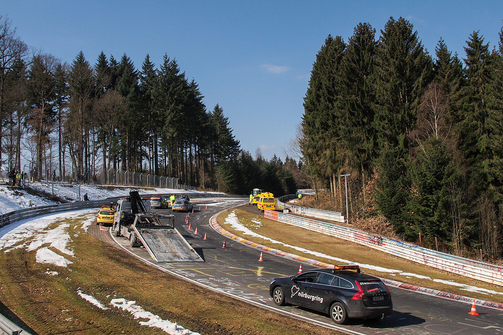 graffiti Nürburgring staff trying to work out what to do about a graffiti doodle. Also note the amount of snow still surrounding the track. Photo by Meaghan O'Brien.